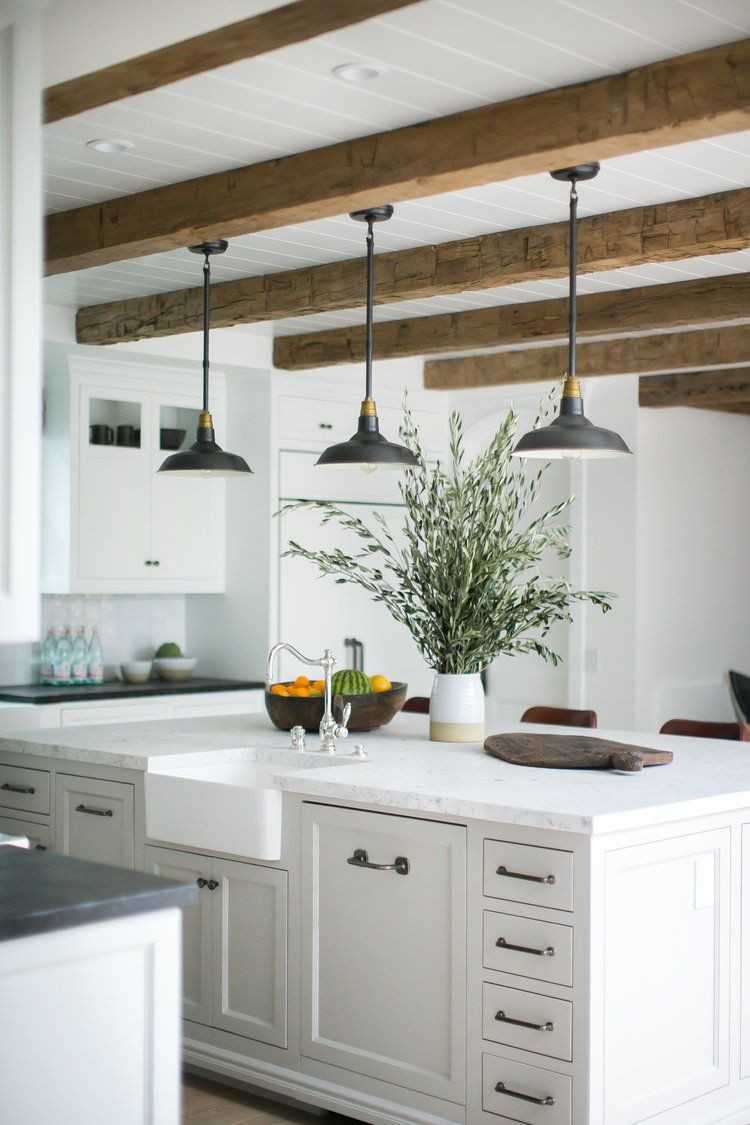 Farmhouse Kitchen Island Lighting
 Rustic beams and pendant lights over a large kitchen