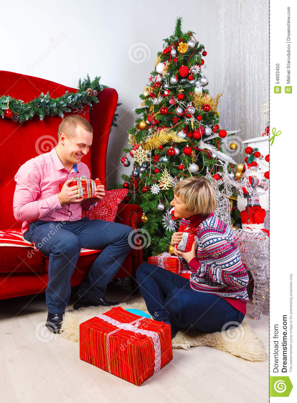 Gift Ideas For Young Couple
 Happy Young Couple With Gifts At New Year Stock