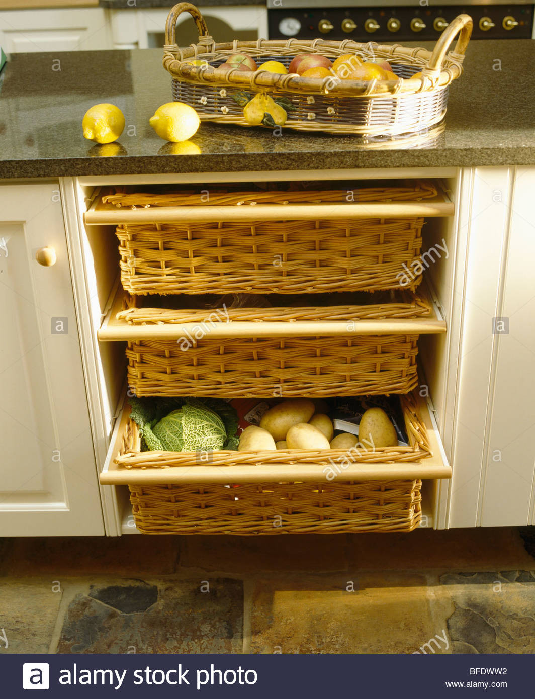 Kitchen Storage Baskets
 Close up of kitchen storage baskets in cream fitted unit
