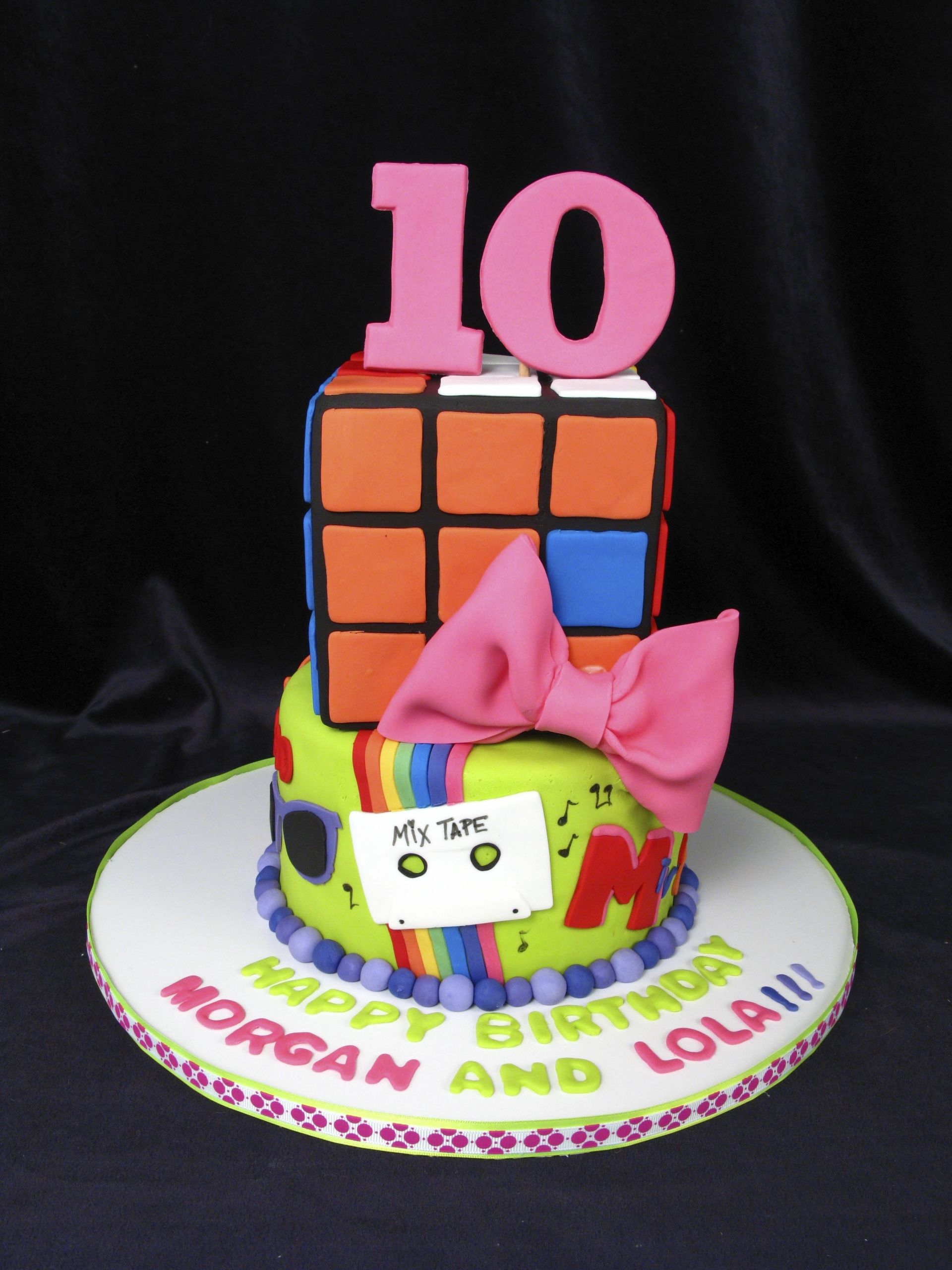 10th Birthday Cake
 Fun 10th birthday cake Rubix cube bows mix tape