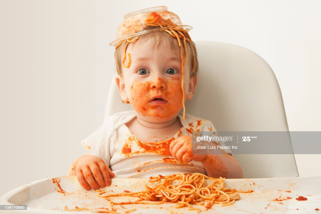 Baby Eating Spaghetti
 Mixed Race Baby Boy Eating Spaghetti High Res Stock