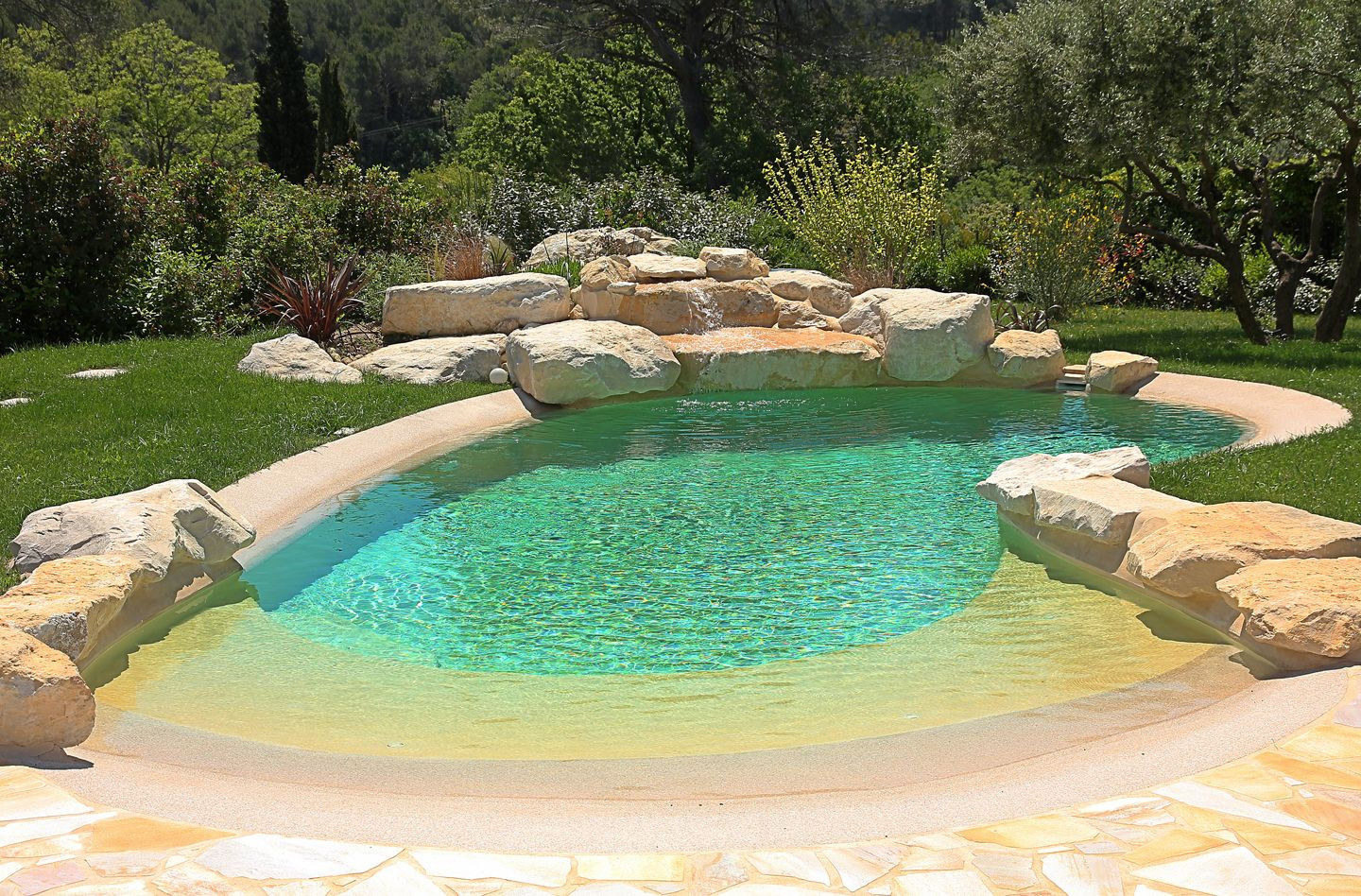 Backyard Beach Pool
 small beach entry pool with rock surrounds is great for a