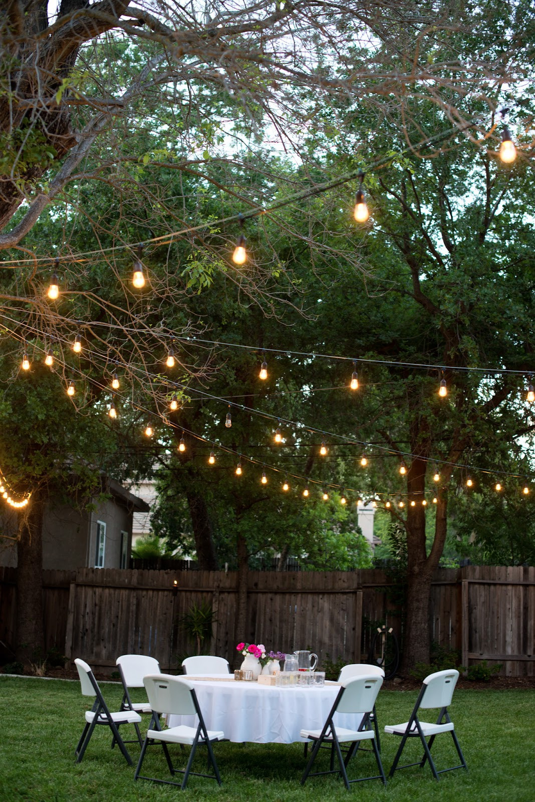 Backyard Party Lights
 Domestic Fashionista Backyard Anniversary Dinner Party