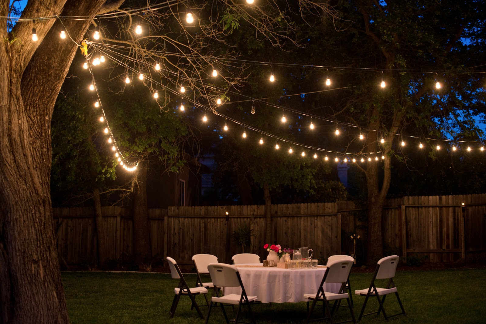 Backyard Party Lights
 Domestic Fashionista Backyard Anniversary Dinner Party