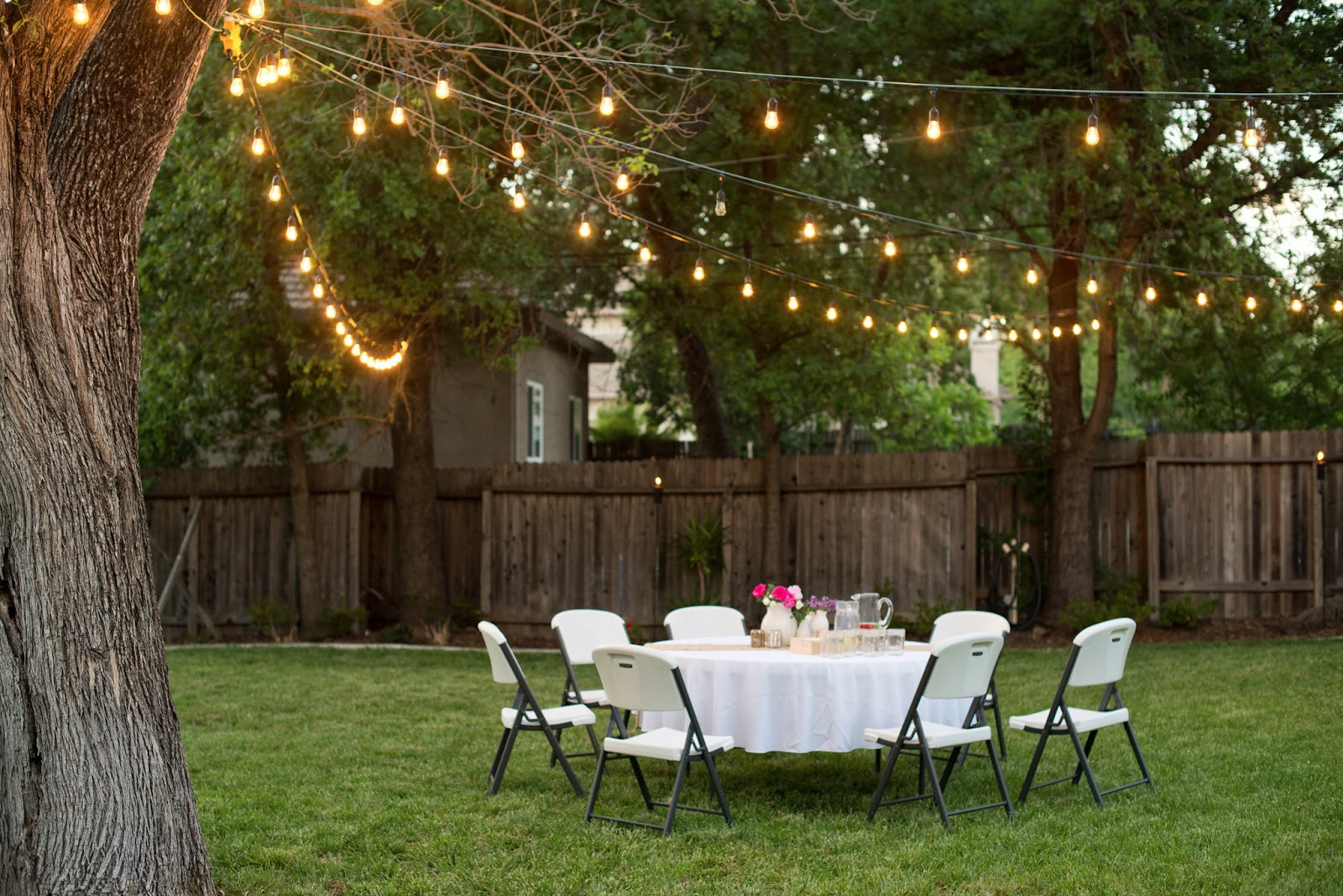 Backyard Party Lights
 Domestic Fashionista Backyard Anniversary Dinner Party