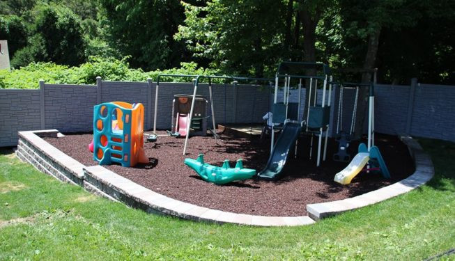 Backyard Play Area
 Unilock Driveway and Backyard Play Area – Backyard