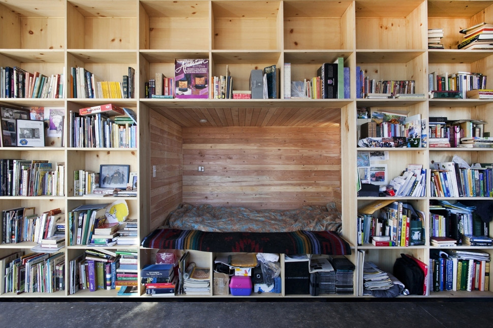 Bedroom Wall Shelves
 Nakai House in Utah Features Wall of Shelves with Bedroom