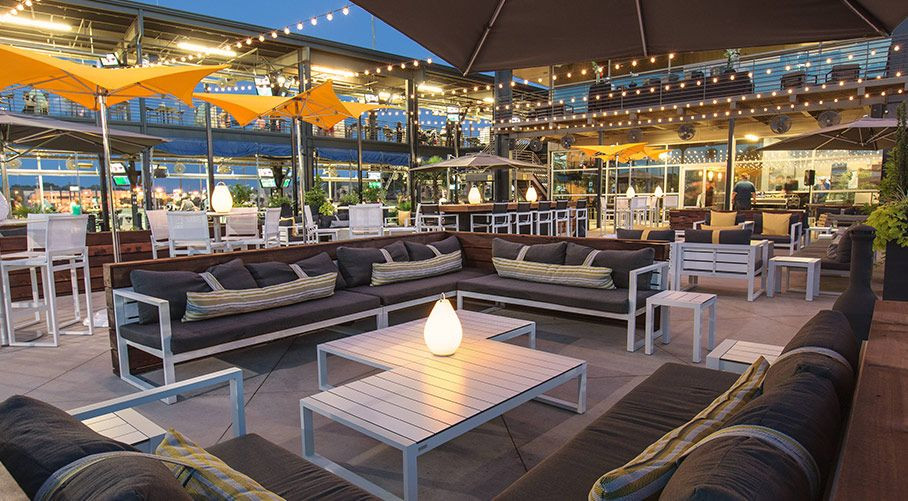 Birthday Party Places Dallas
 outdoor lounge and dining Topgolf Dallas