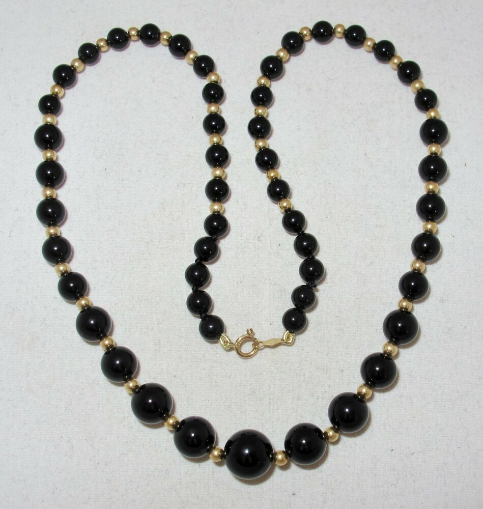 Black Bead Necklace
 16" Graduated Black yx Bead Necklace with 14K Yellow