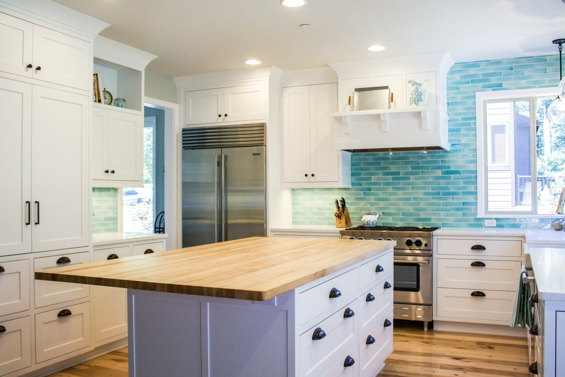 Blue Tile Backsplash Kitchen
 Custom designed kitchen with white cabinets and bold blue