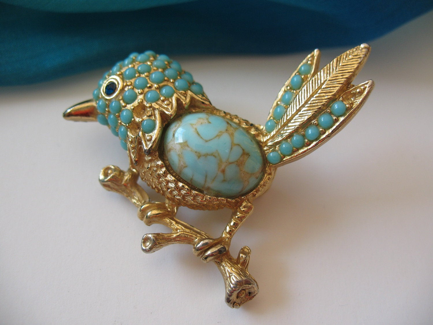 Brooches Bird
 bird brooch gold tone and turqouise stones by LIGONaccessories