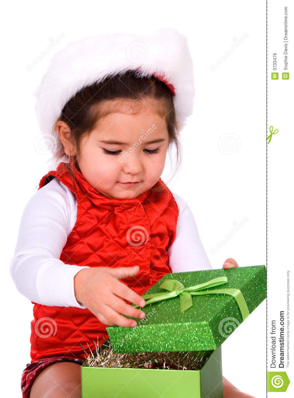 Child Gifts
 Child Opening Christmas Gift Stock Image of