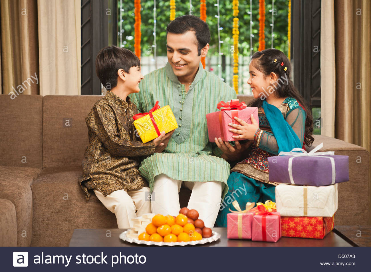 Children Are Gifts
 Children giving ts to their father on Diwali Stock