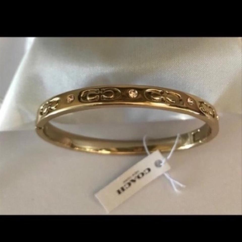 Coach Bangle Bracelet
 Coach Signature Gold Kissing C Bangle Bracelet Tradesy