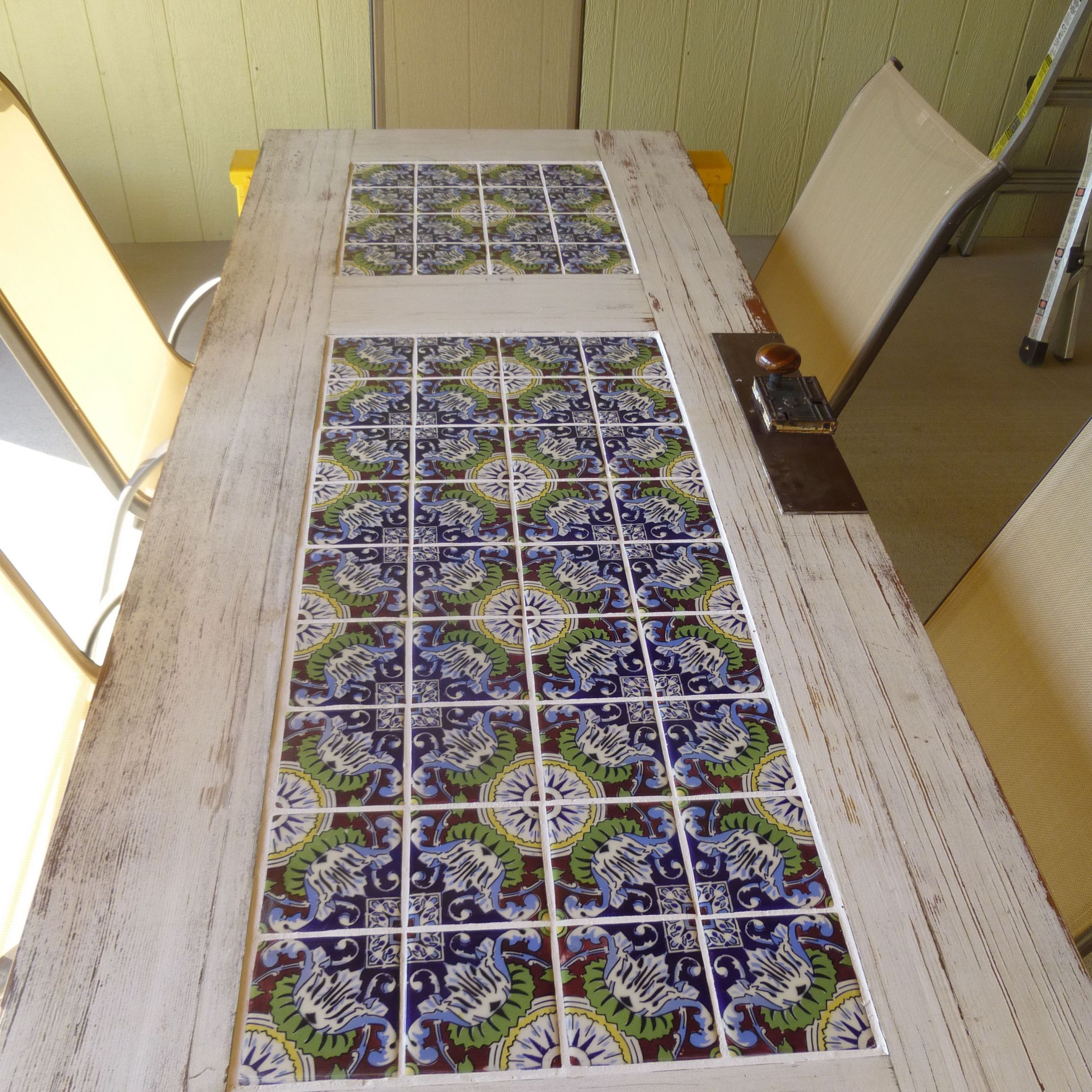 DIY Outdoor Tile Table
 Tile and a old door = patio table