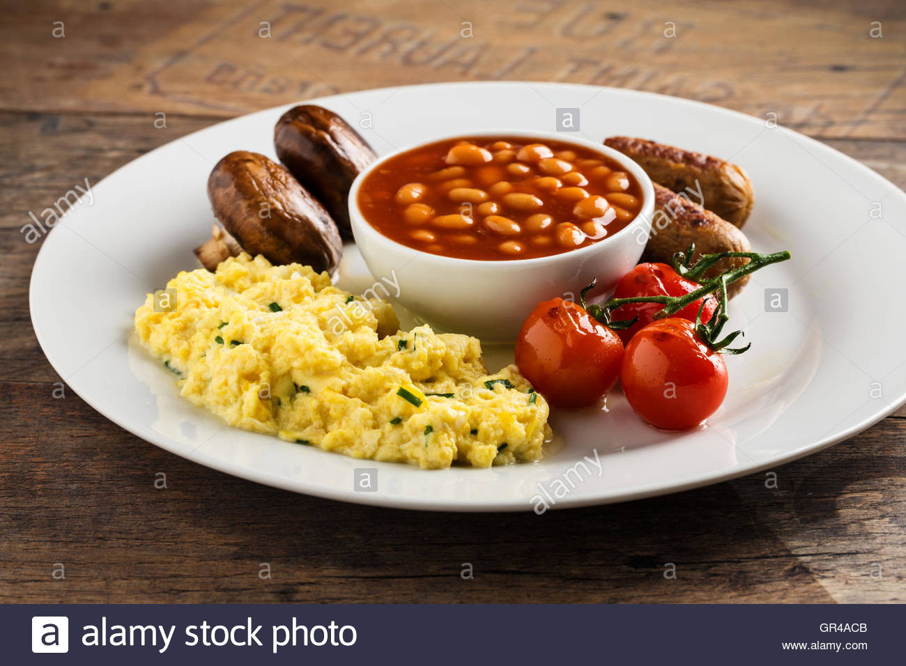 Eggs And Beans Breakfast
 Breakfast with sausages scrambled eggs baked beans