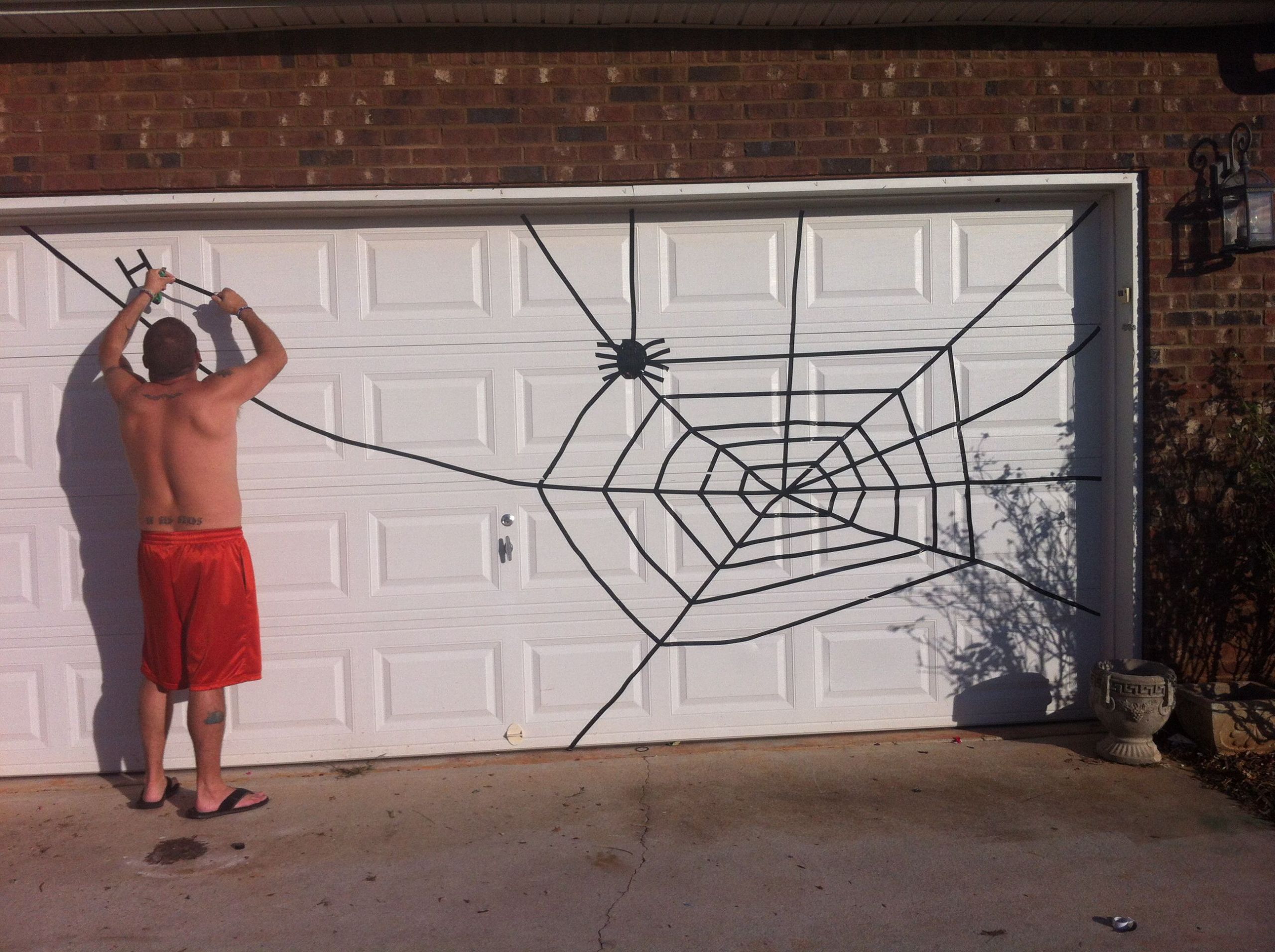 Garage Door Halloween Decorations
 Spider web for Halloween Garage Door Use electrical tape