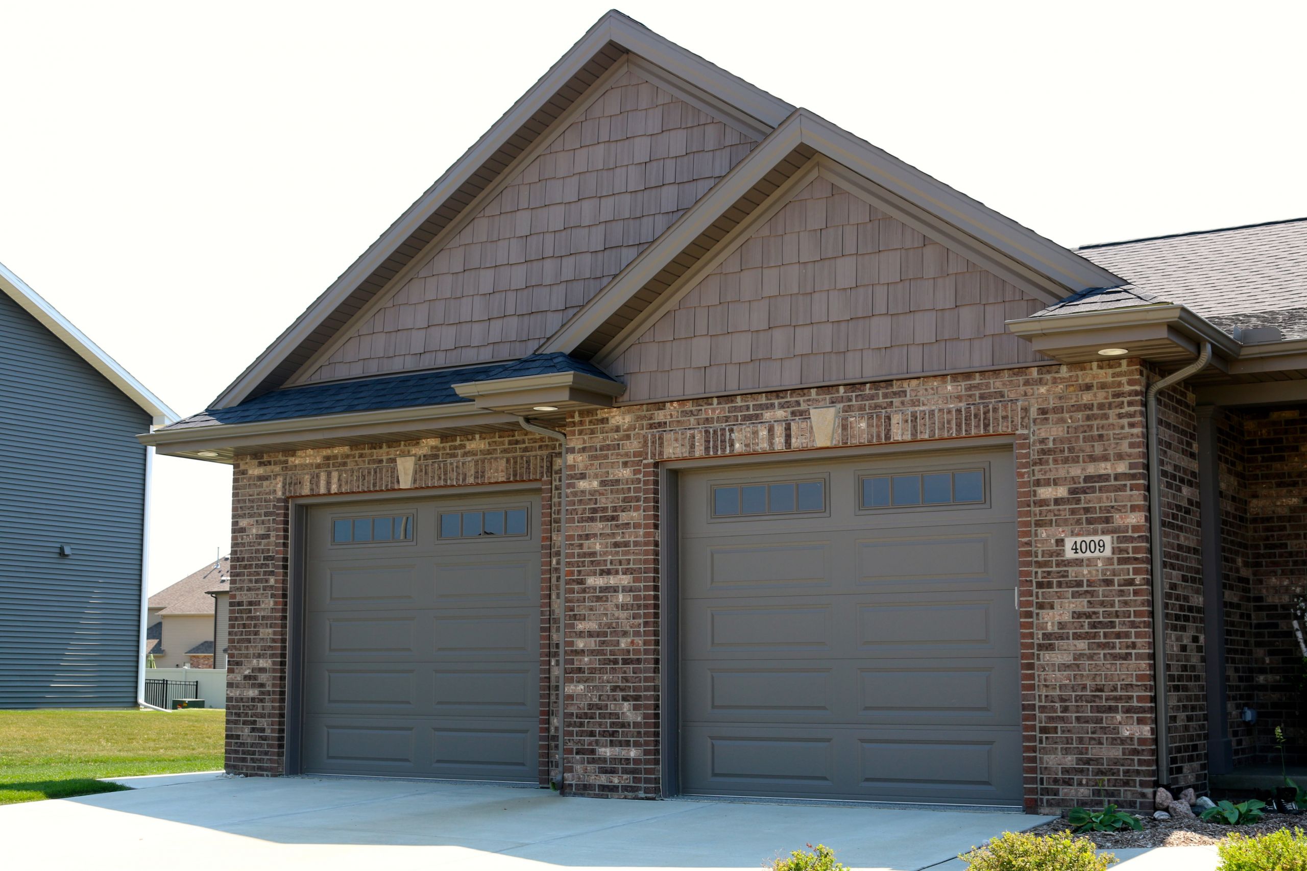 Garage Door Panels
 Bronze garage doors with long panels and mission window