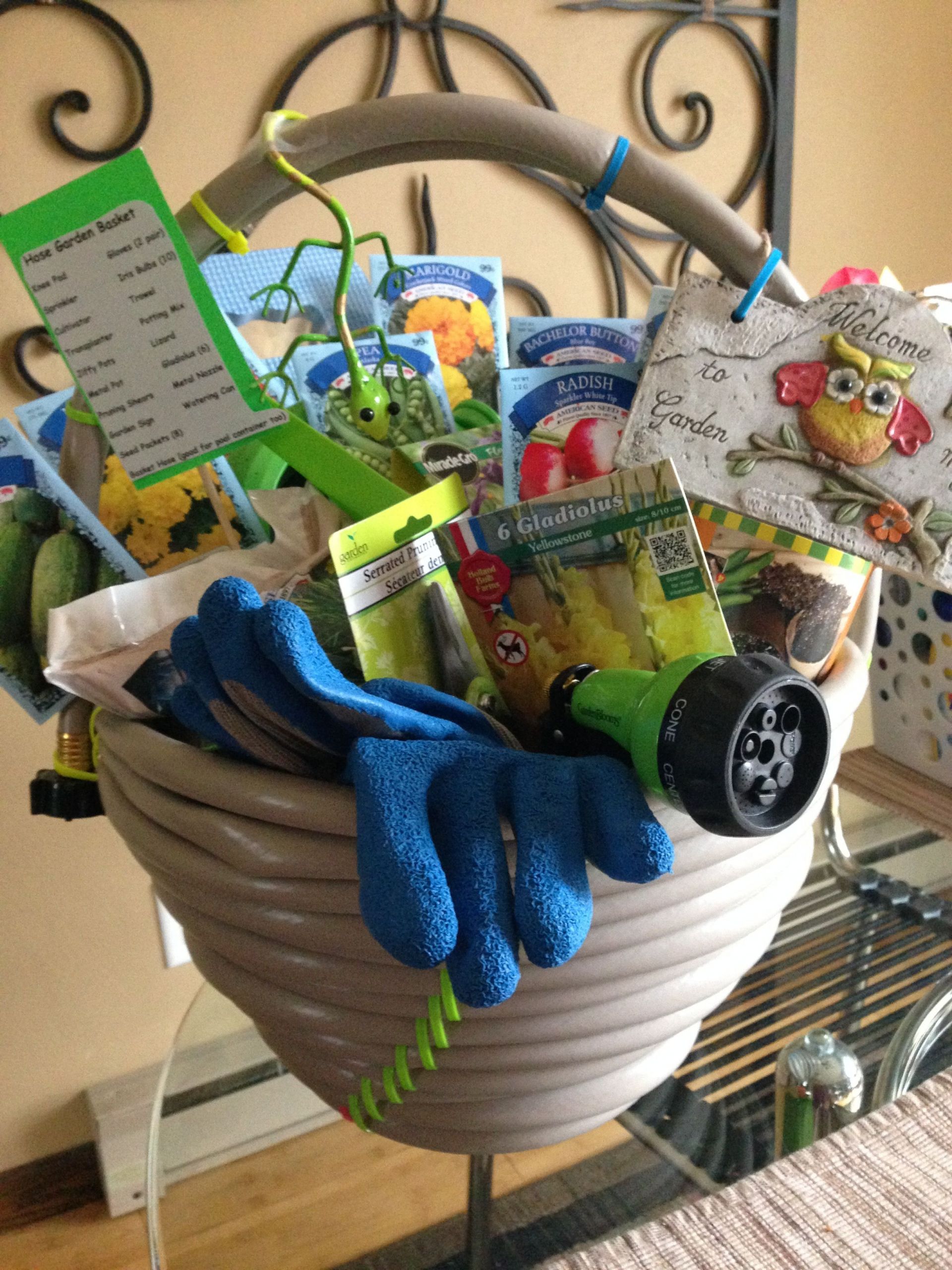 Garden Gift Baskets Ideas
 Garden hose basket For a fundraiser