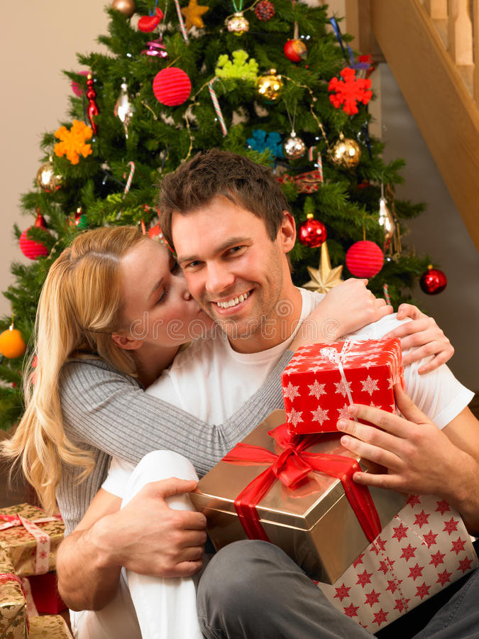 Gift Ideas For Young Couples
 Young Couple With Gifts In Front Christmas Tree Stock