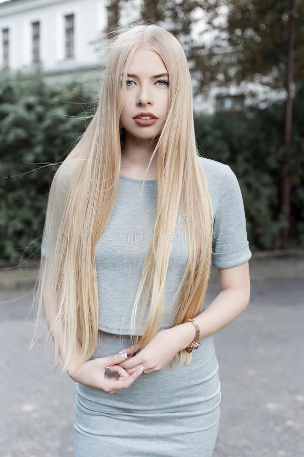 Girl Blonde Hairstyles
 Portrait A Beautiful Cute Girl With Long Blond Hair In