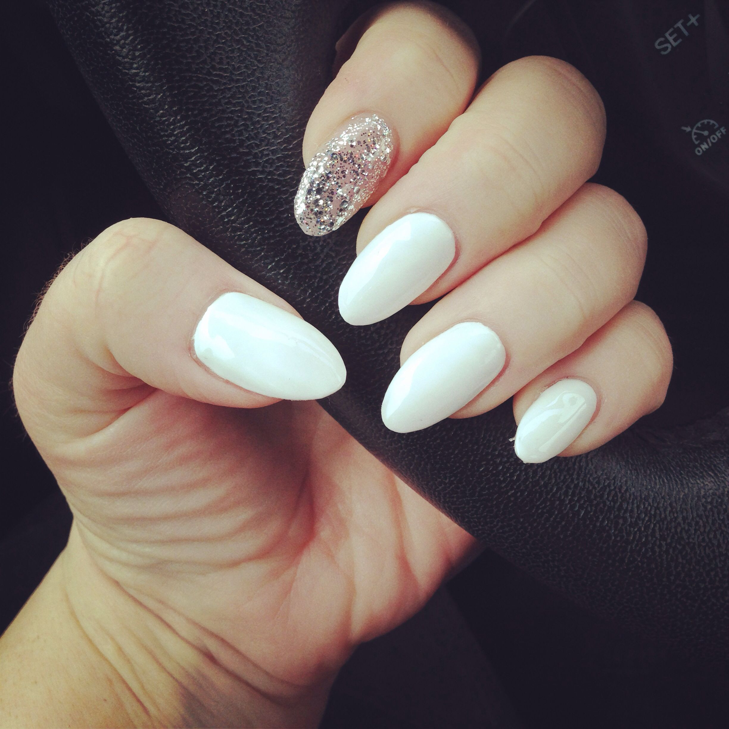 Glitter Almond Nails
 White almond nails with silver glitter accent