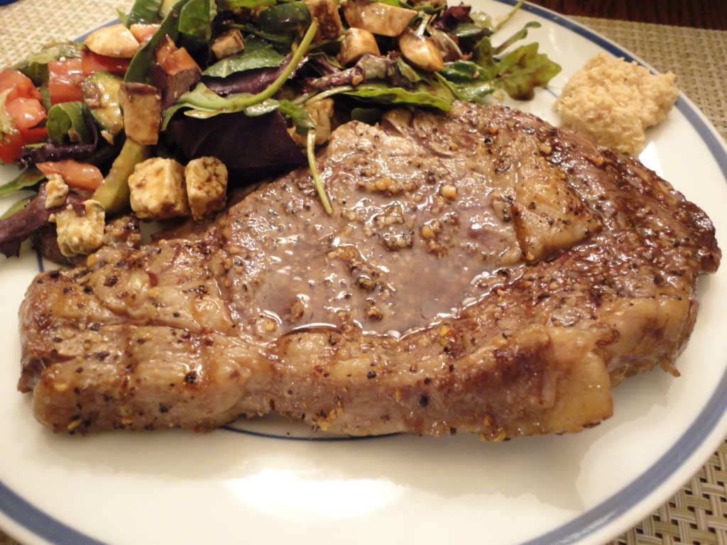 Grilled Prime Rib Steak
 Hand Cut Prime Grade Rib Eye Steak Grilled on a Plate We