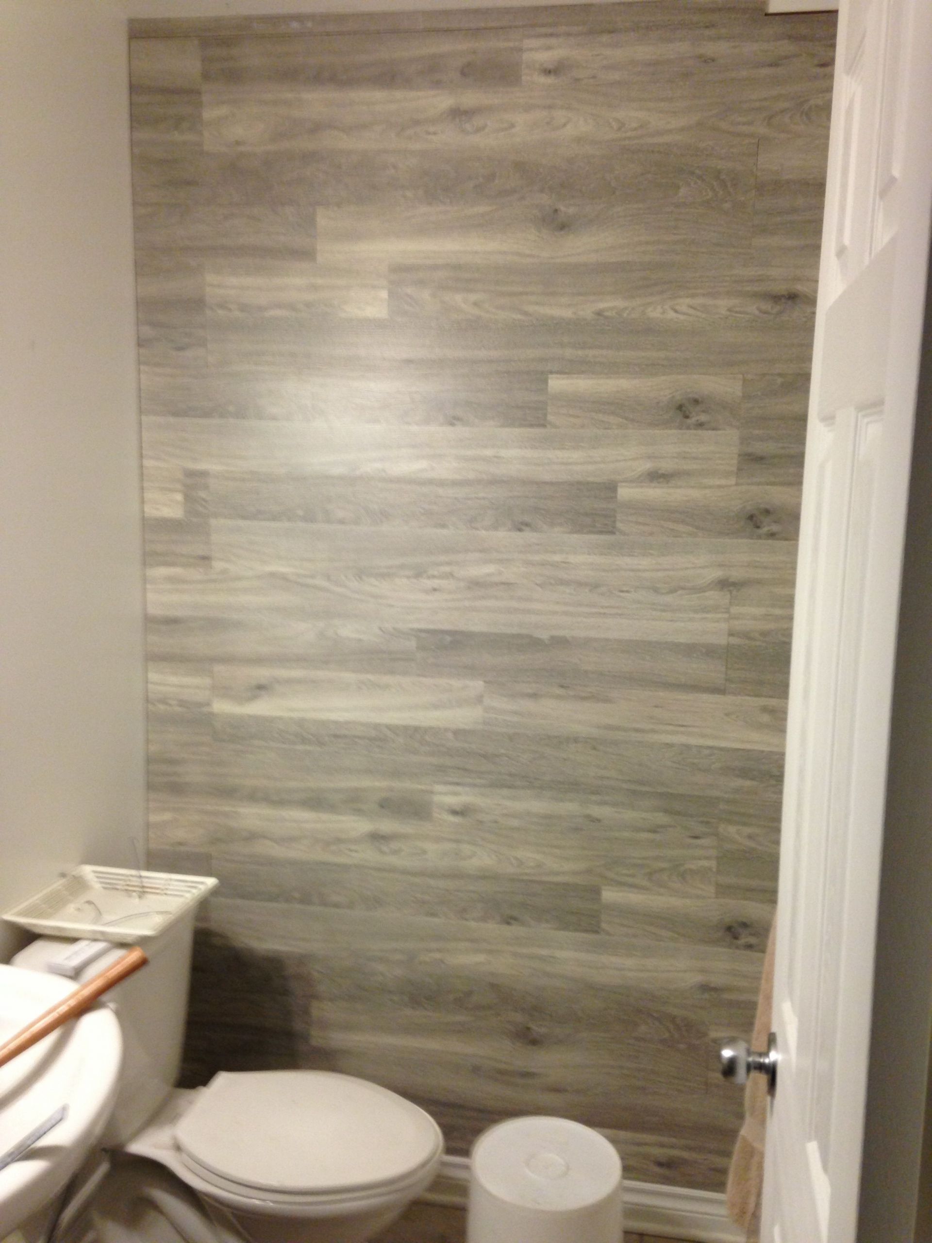 Laminate Bathroom Walls
 Bored to Floored Laminate Floor Accent Wall DIY