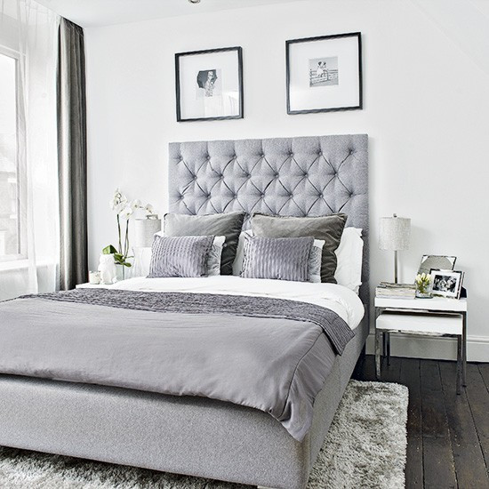 Modern Gray Bedroom
 Modern bedroom with grey upholstered bed and soft