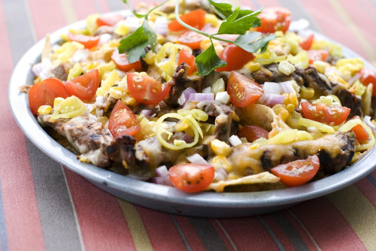 Nachos In Microwave
 Moving nachos out of the microwave onto the grill