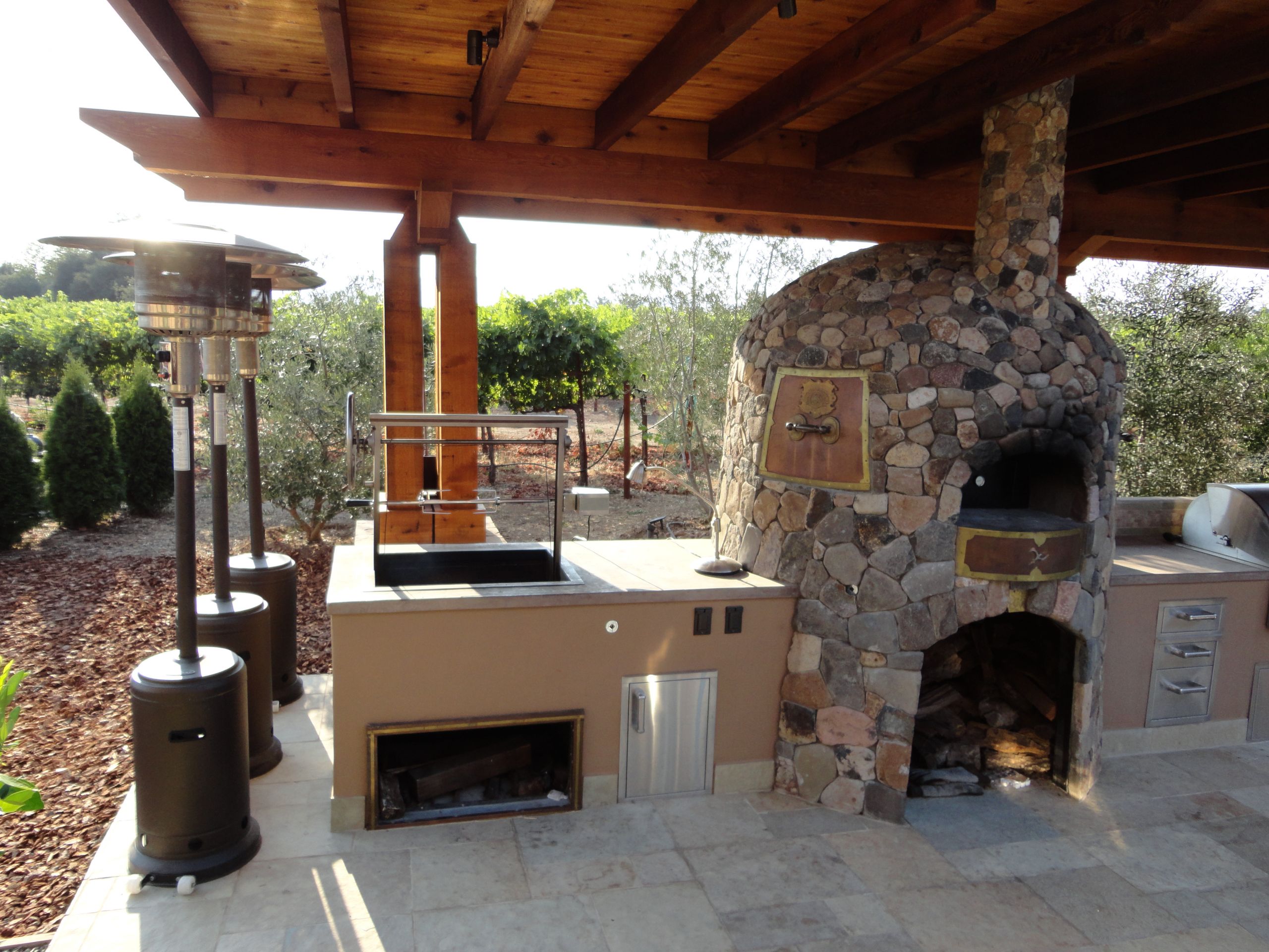 Outdoor Kitchen Pizza Oven
 Cedar Arbor spanning outdoor kitchen designed by Leasure