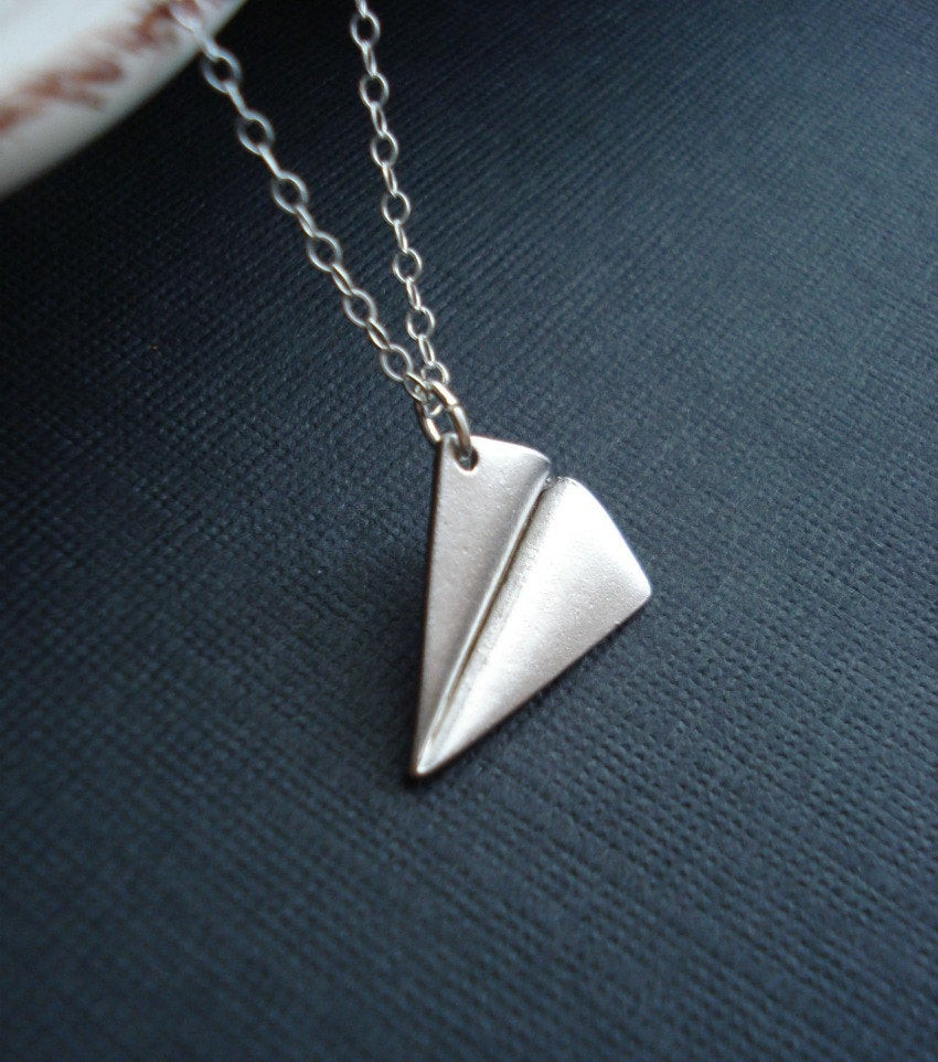 Paper Airplane Necklace
 Paper Airplane Necklace In Silver e Direction by