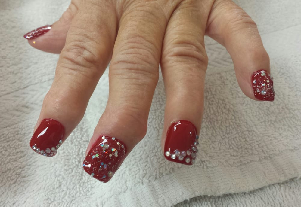 Red Glitter Acrylic Nails
 Acrylic nails with red and silver glitter polish and