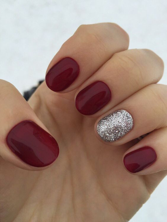 Red Nails With Silver Glitter
 Picture red nails with an accent silver glitter one is