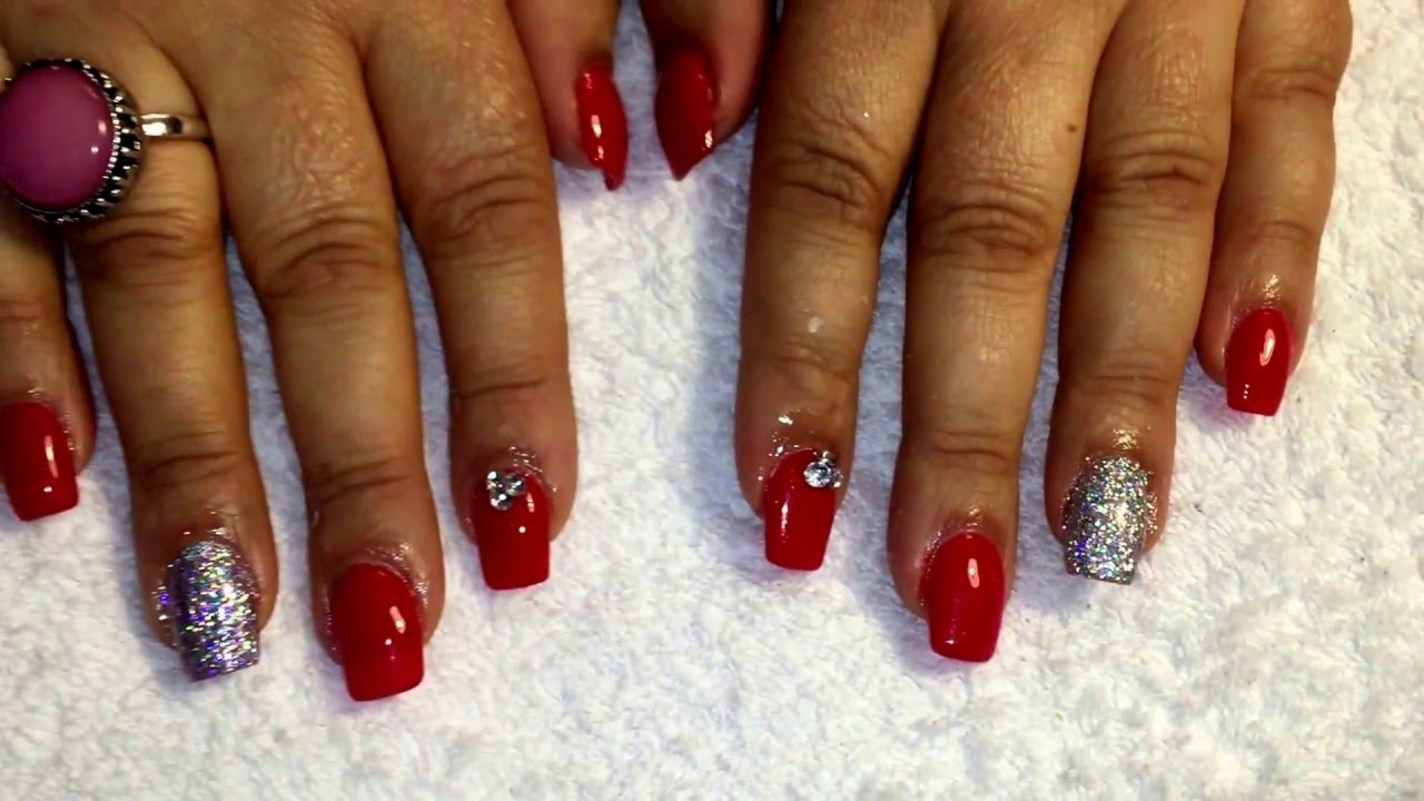 Red Nails With Silver Glitter
 Acrylic nails new set red with silver glitter