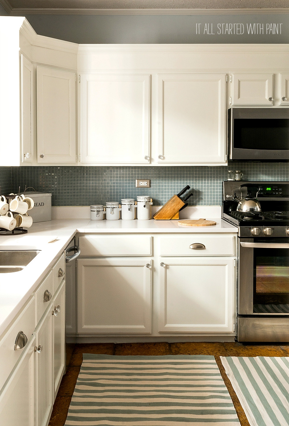 Repainting Kitchen Cabinets White
 Builder Grade Kitchen Makeover with White Paint