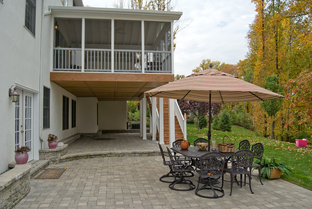 Screened In Backyard
 Screened Porch with Under Decking System and Paver Patio