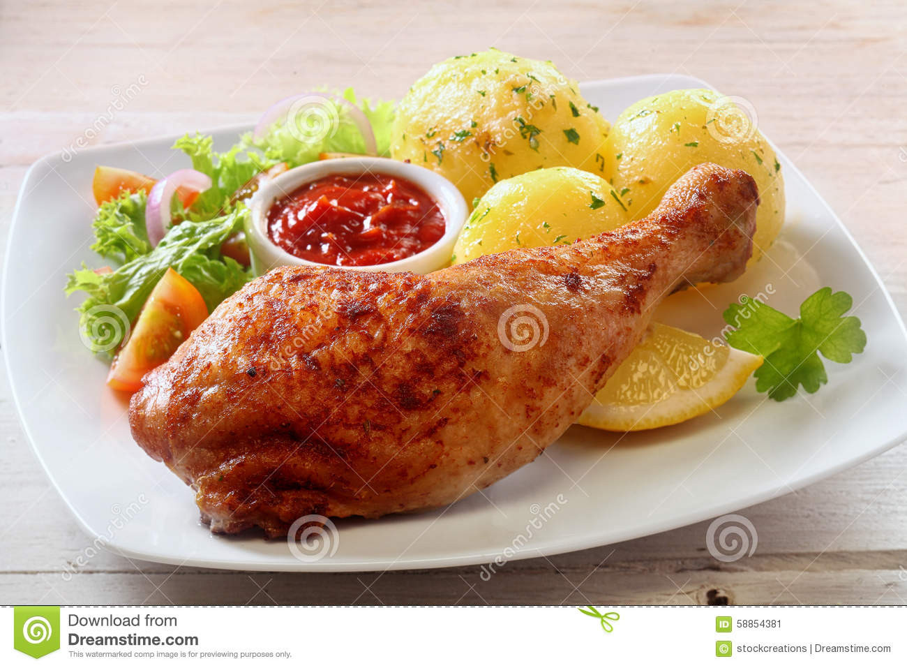 Side Dishes Grilled Chicken
 Healthy Chicken Leg Dinner With Fresh Side Dishes Stock