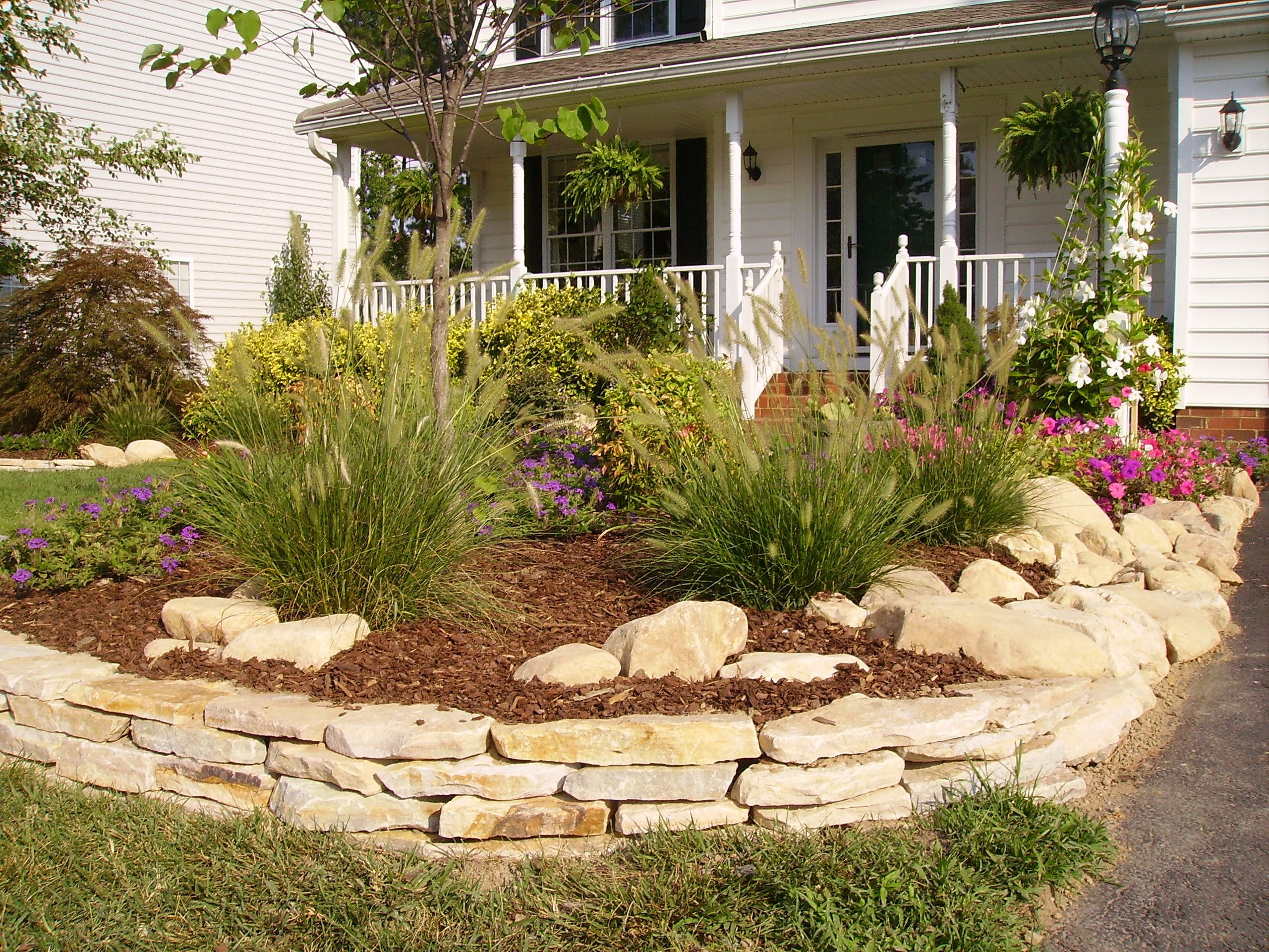 Stacked Stone Landscape Edging
 In this photo the stacked stone is edging the flowerbed