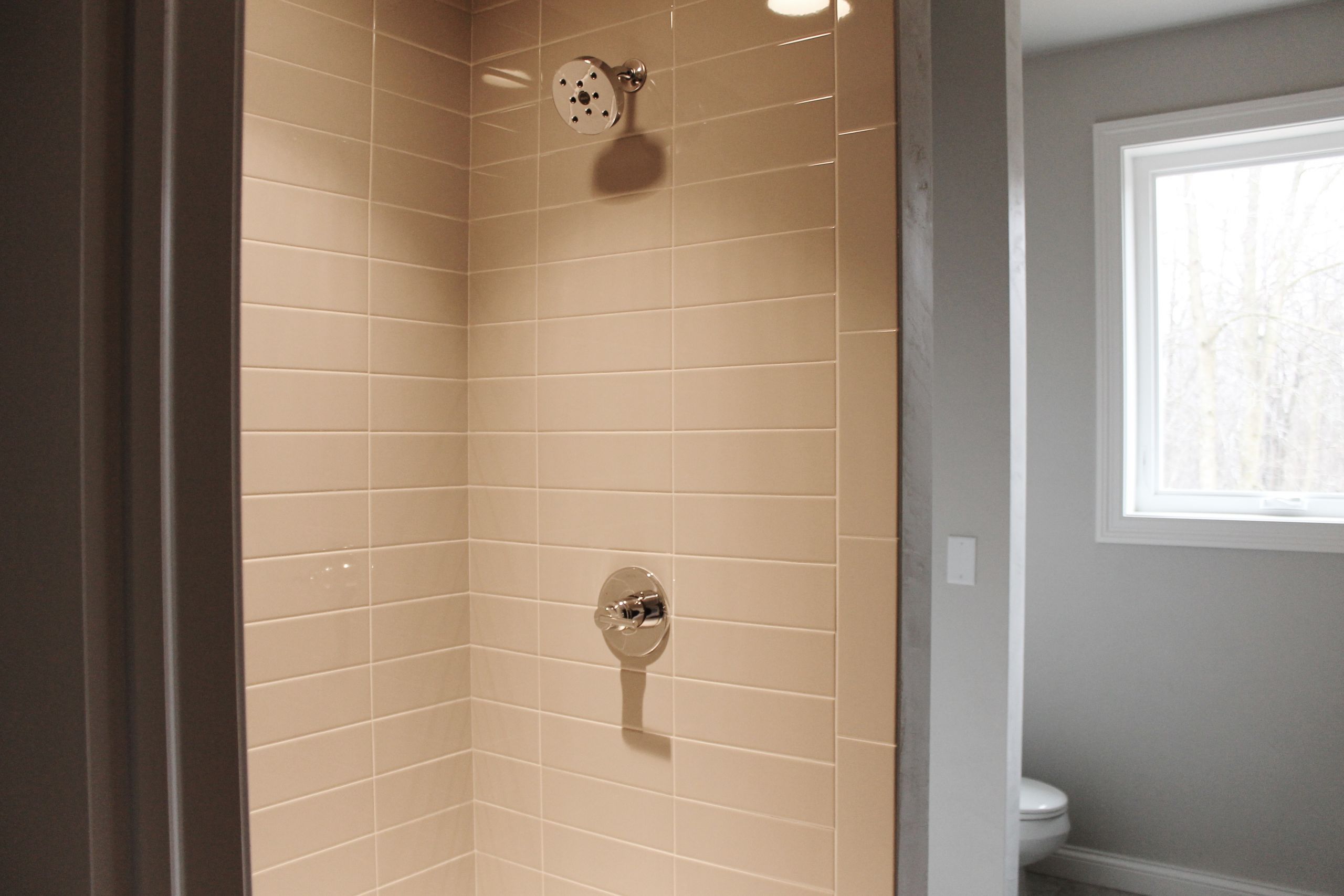 Subway Tile Bathroom Shower
 Tour 3790 Copper Oak in Howard – Katie Jane Interiors