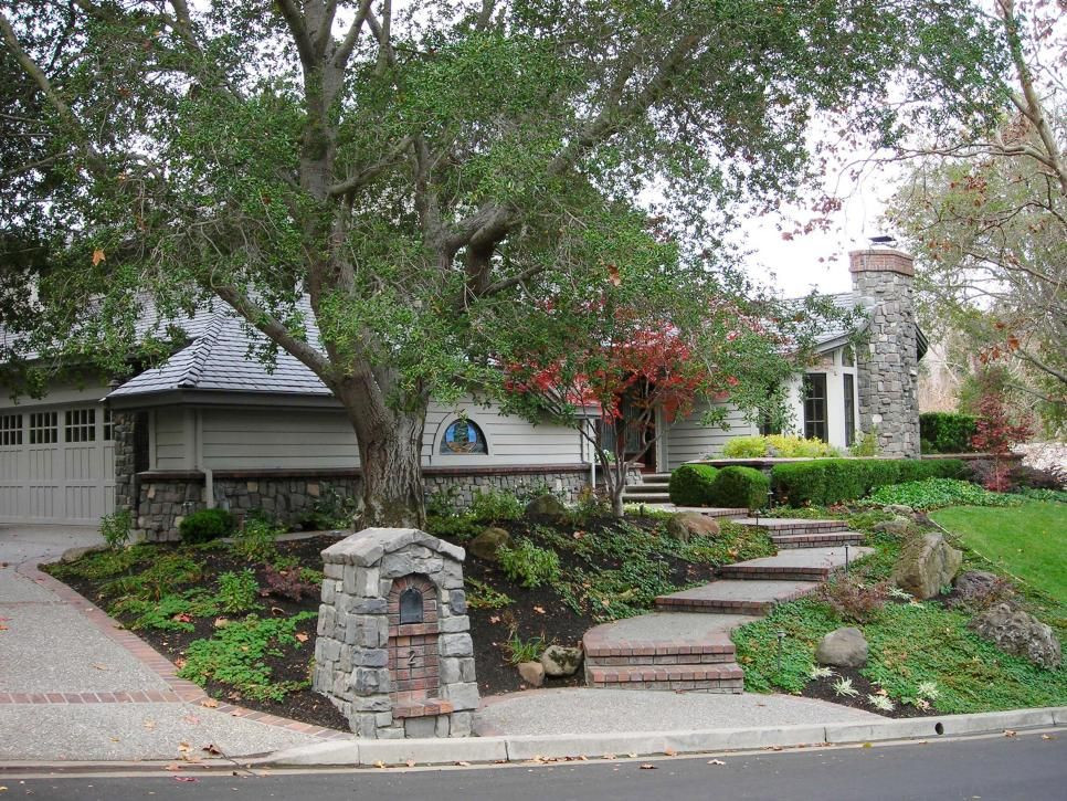 Terrace Landscape Curb Appeal
 This stone framed home exudes curb appeal with a terraced