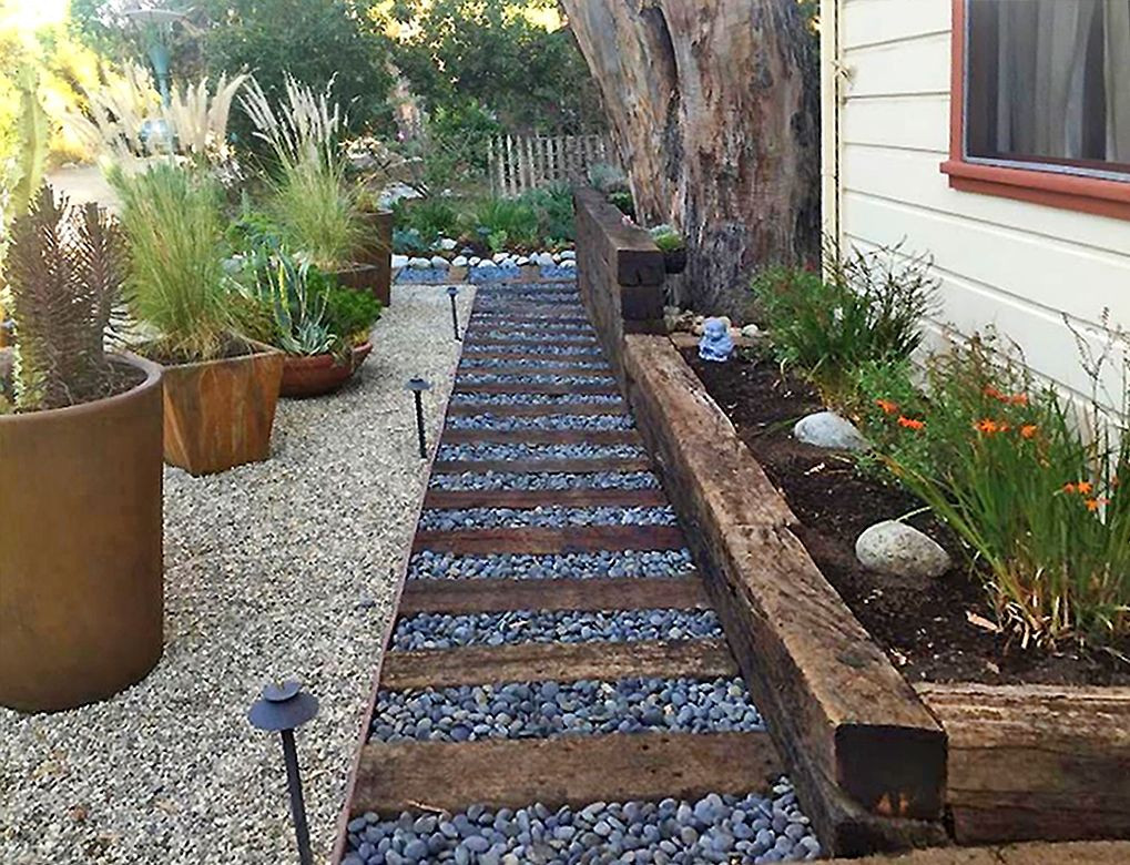 Terrace Landscape With Railroad Ties
 A creative use of railroad ties river rocks and gravel