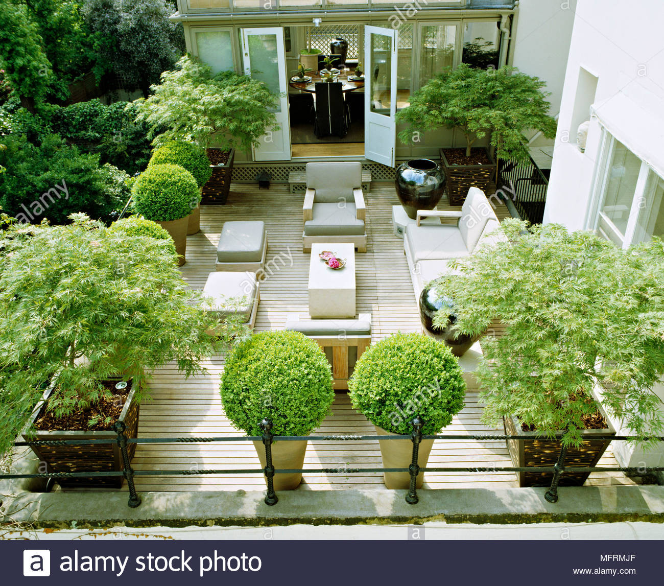 Terrace Landscape With Trees
 A modern town garden roof terrace with decked patio area
