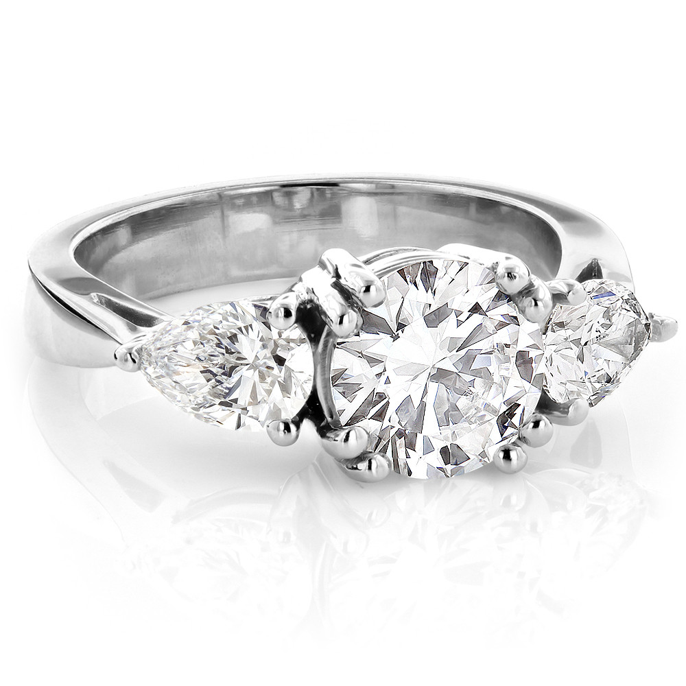 Three Diamond Engagement Ring
 Platinum Three Stone Round and Pear Diamond Engagement
