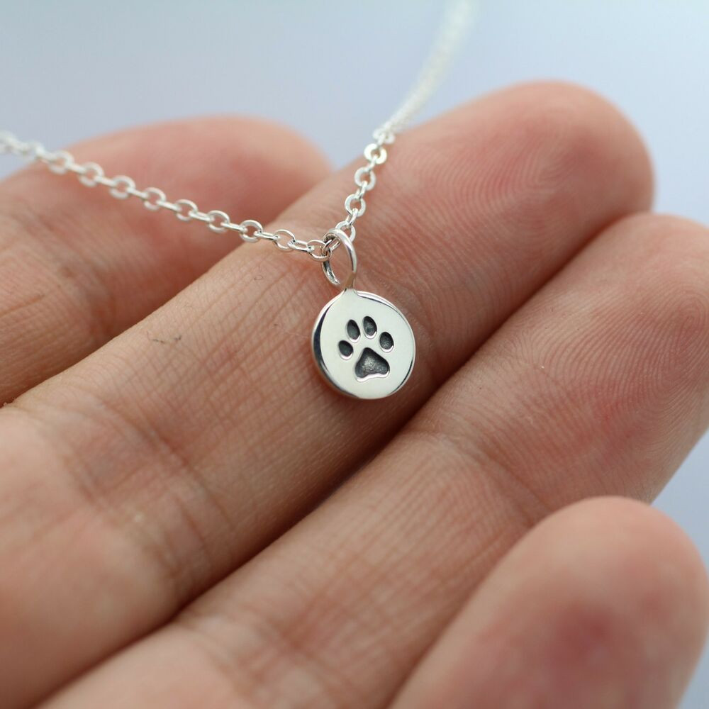 Tiny Charm Necklace
 TINY PAW PRINT NECKLACE 925 Sterling Silver Paw Charm