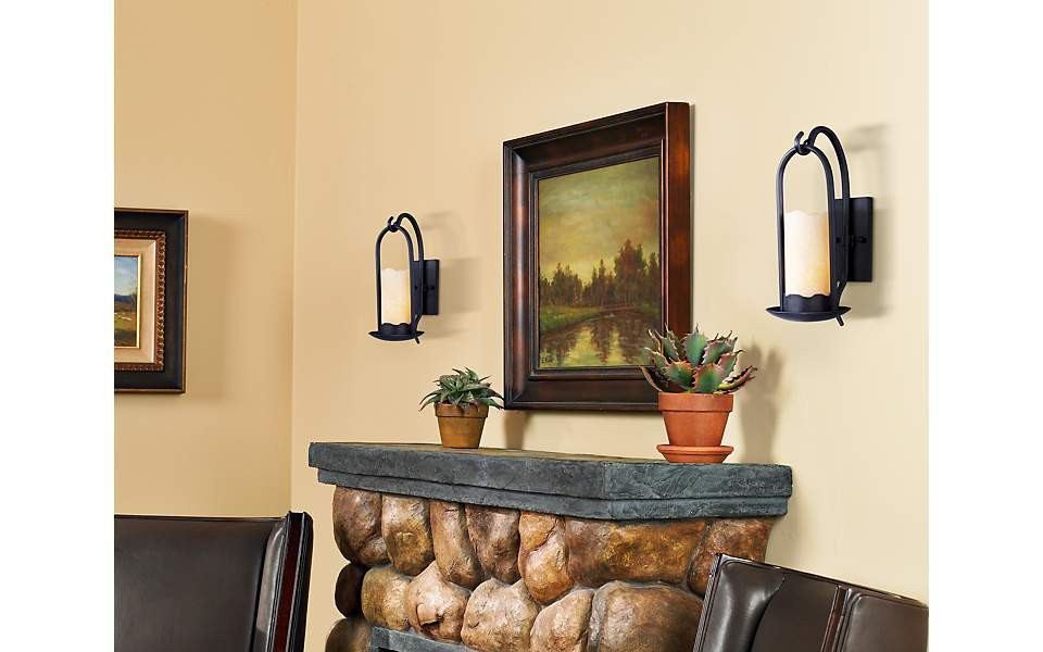 Wall Sconces For Living Room
 Rustic wall sconces brighten a living room fireplace