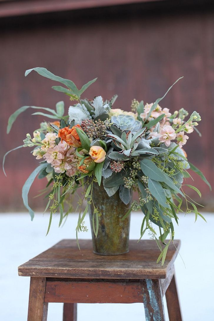 Wedding Flowers Cincinnati
 Peach and blue centerpiece in a patinaed copper pot by