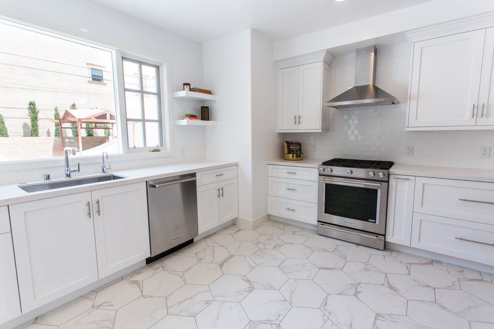 White Marble Kitchen Floor
 Beautiful clean white kitchen with carrara marble