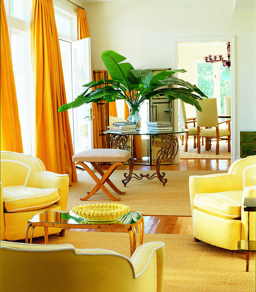 Yellow Living Room Curtains
 Floor to ceiling lemon yellow curtains add drama to the